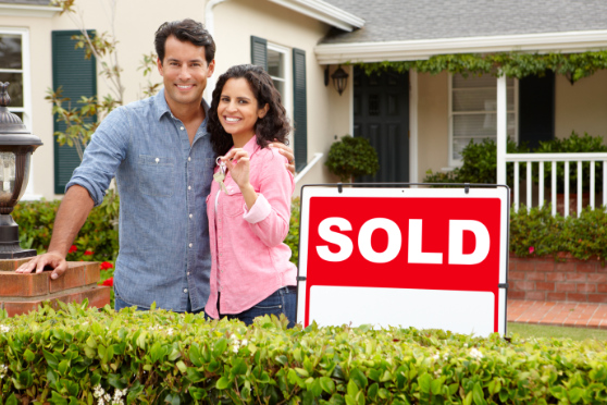 conveyancing buying a new home couple with keys to new home